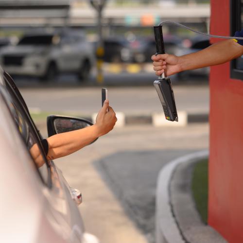 Can You Be Pinged For Using Your Phone To Pay At A Drive-Through Window?